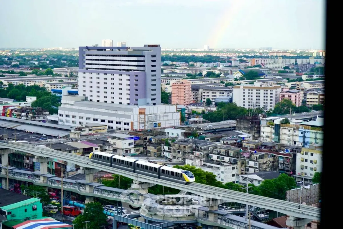 Stunning cityscape view with modern train and urban skyline, perfect for real estate investment.