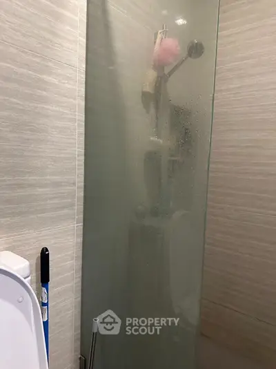 Modern bathroom with glass shower enclosure and sleek design