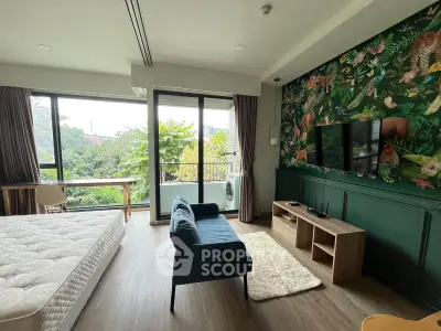 Chic bedroom with vibrant wallpaper and balcony view in modern apartment