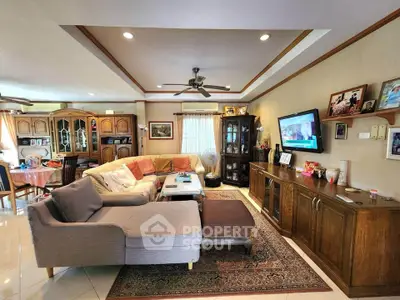 Spacious living room with cozy sectional sofa and elegant wooden cabinetry