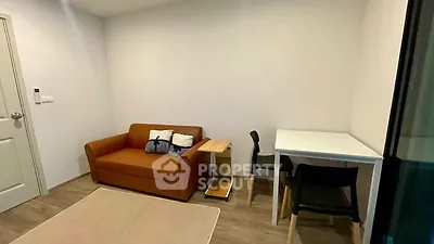 Cozy living room with brown sofa and modern furniture in a stylish apartment.