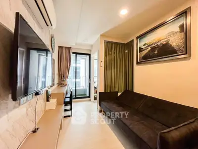 Modern living room with sleek TV and balcony view