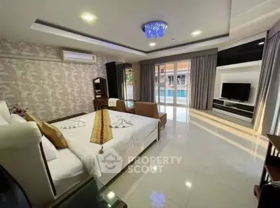 Luxurious bedroom with pool view and elegant decor