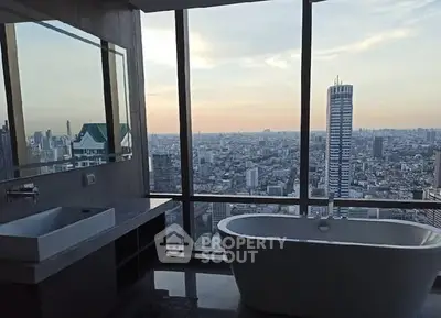 Luxurious bathroom with stunning city skyline view and modern bathtub