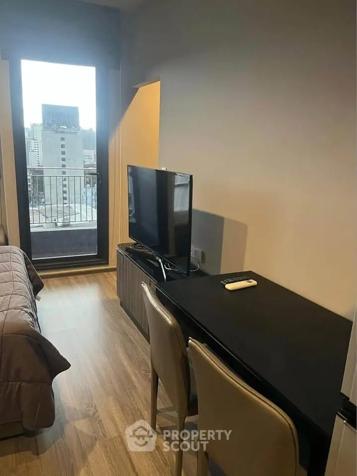 Modern studio apartment with city view and sleek furnishings