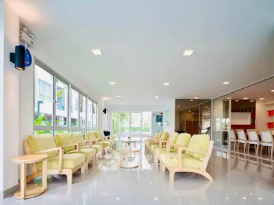 Spacious modern living room with ample seating and natural light