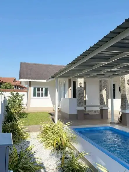 Charming single-story home with pool and covered patio, perfect for outdoor living.