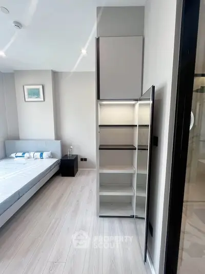 Modern bedroom with sleek storage and minimalist design
