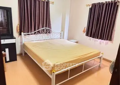 Cozy bedroom with elegant metal bed frame and warm curtains