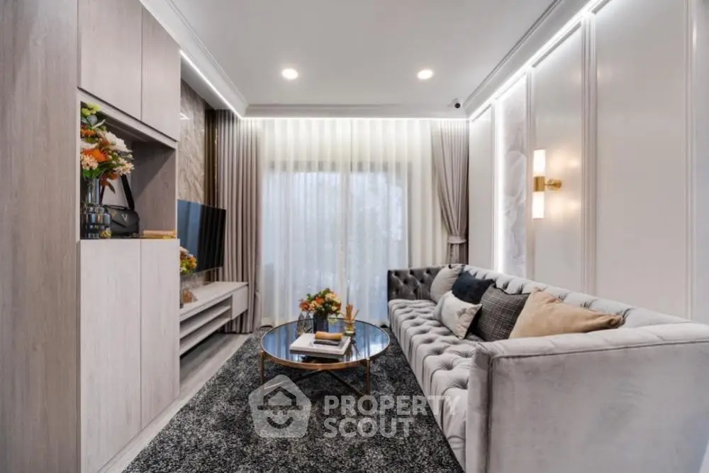 Luxurious living room with elegant decor and plush sofa in modern apartment