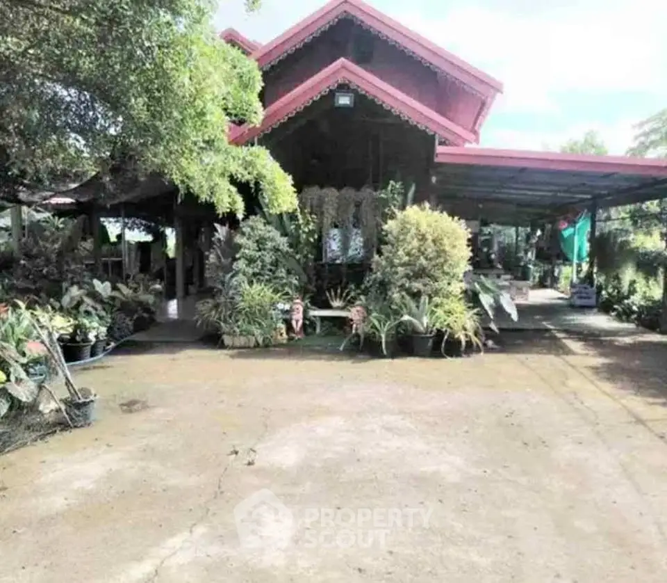 Charming garden view of a rustic home with lush greenery and spacious outdoor area.