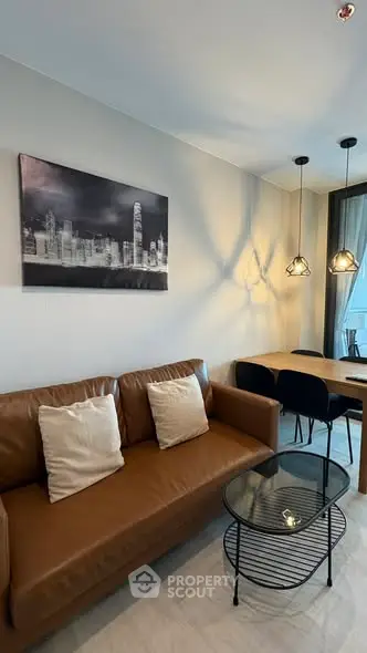 Modern living room with stylish decor and cozy seating area, perfect for relaxation and entertaining.