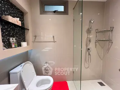 Modern bathroom with glass shower and sleek fixtures