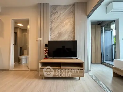 Modern living room with TV stand, open layout, and stylish decor