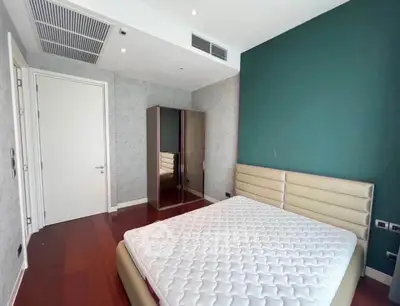 Modern bedroom with stylish decor and hardwood flooring