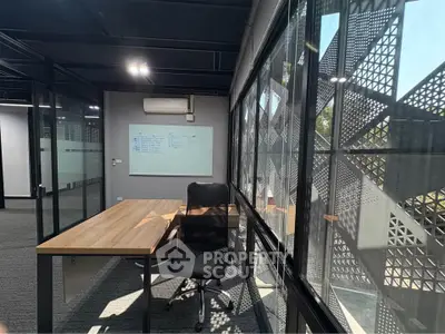 Modern office space with large windows and sleek furniture