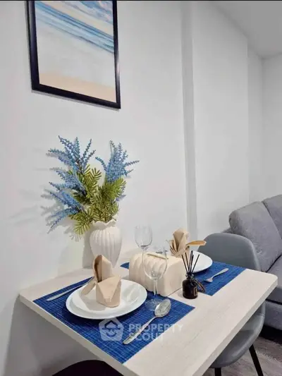 Chic dining nook with elegant table setting and modern decor in cozy apartment.