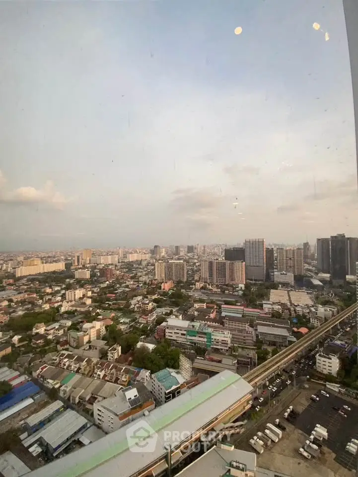 Stunning cityscape view from high-rise building, showcasing urban skyline and vibrant city life.