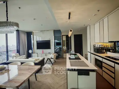 Luxurious open-plan living room and kitchen with city view, modern furnishings, and elegant decor.