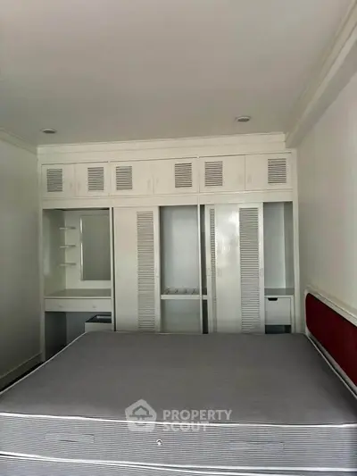 Spacious bedroom with built-in storage and modern design