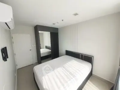 Modern bedroom with sleek design and ample natural light