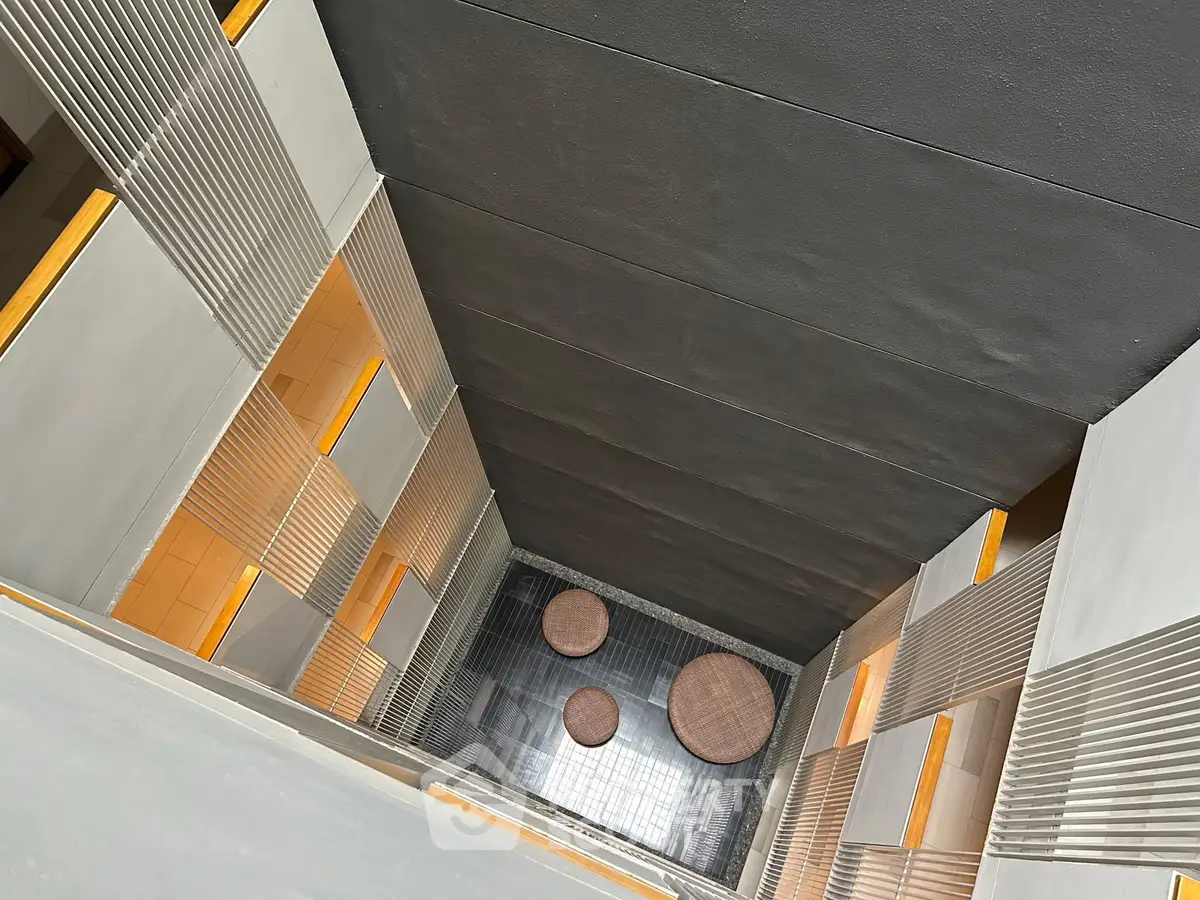 Modern building interior with unique architectural design and open atrium view.