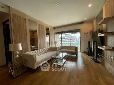 Spacious modern living room with elegant furniture and city view