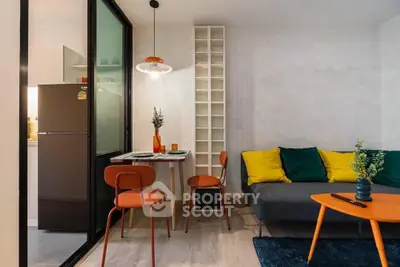 Stylish modern living room with vibrant decor and compact dining area, perfect for urban living.