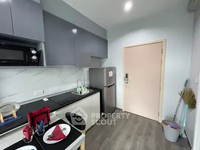 Modern kitchen with sleek cabinetry and stainless steel appliances