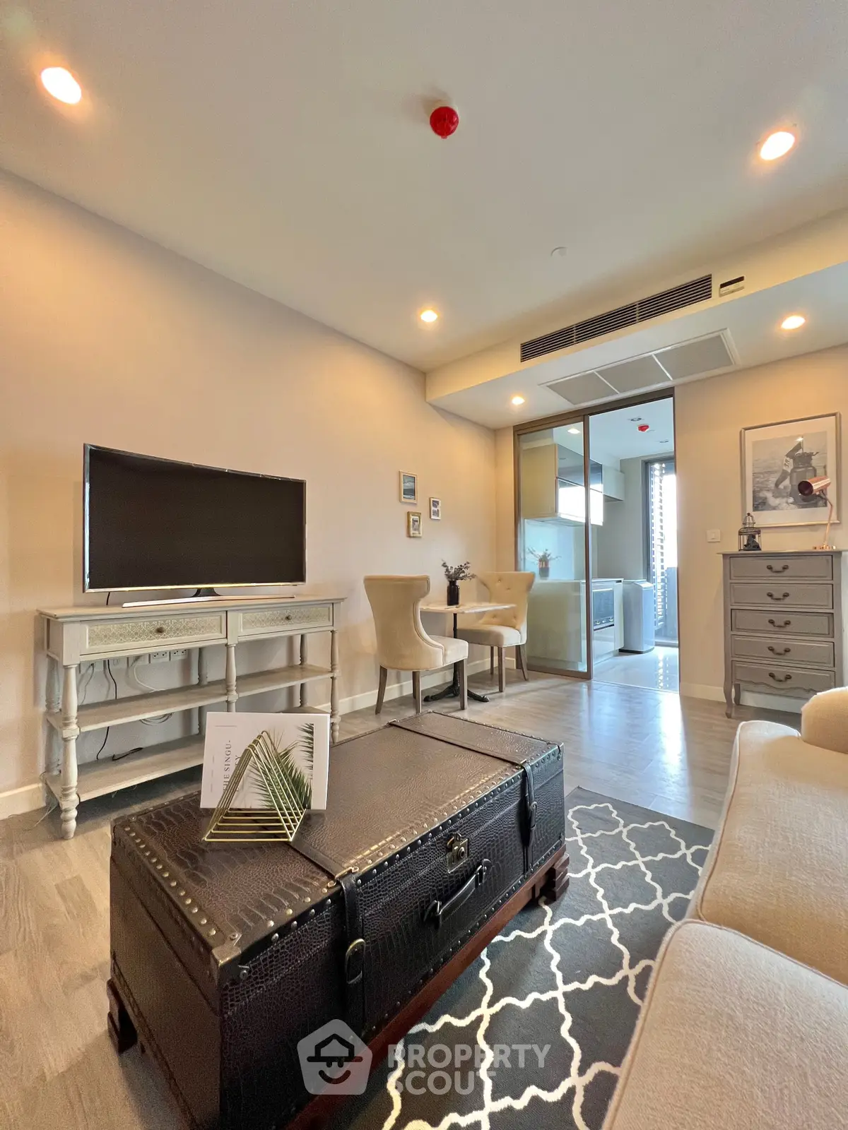 Stylish living room with modern decor and elegant furniture in a cozy apartment setting.