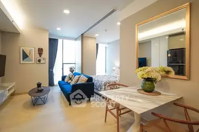 Modern open-plan living room with stylish decor and natural light