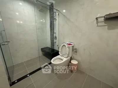 Modern bathroom with glass shower and sleek tile design