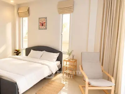 Bright and cozy bedroom with modern decor and natural light