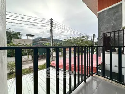 Charming balcony with scenic mountain view, perfect for relaxation and enjoying the outdoors.