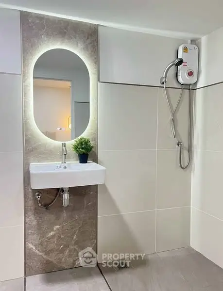 Modern bathroom with illuminated mirror and sleek shower design
