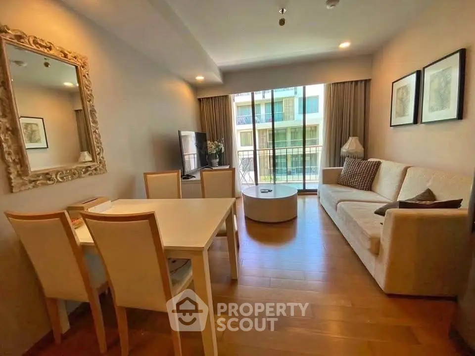 Spacious living room with elegant decor and balcony view in modern apartment