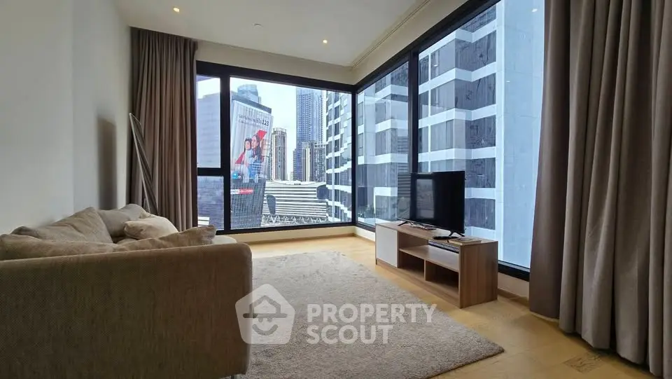 Modern living room with floor-to-ceiling windows offering stunning city views, cozy sofa, and sleek TV setup.