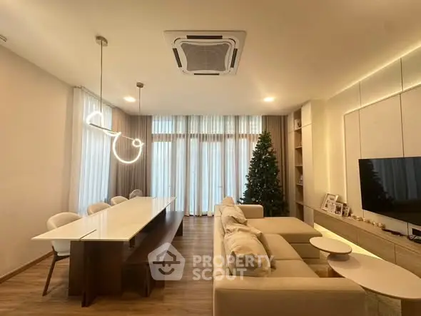 Modern living room with elegant lighting and cozy seating area