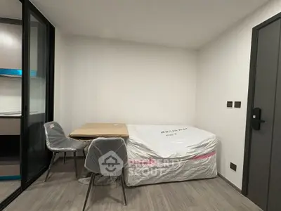Compact bedroom with minimalist design and modern furnishings in a cozy apartment.