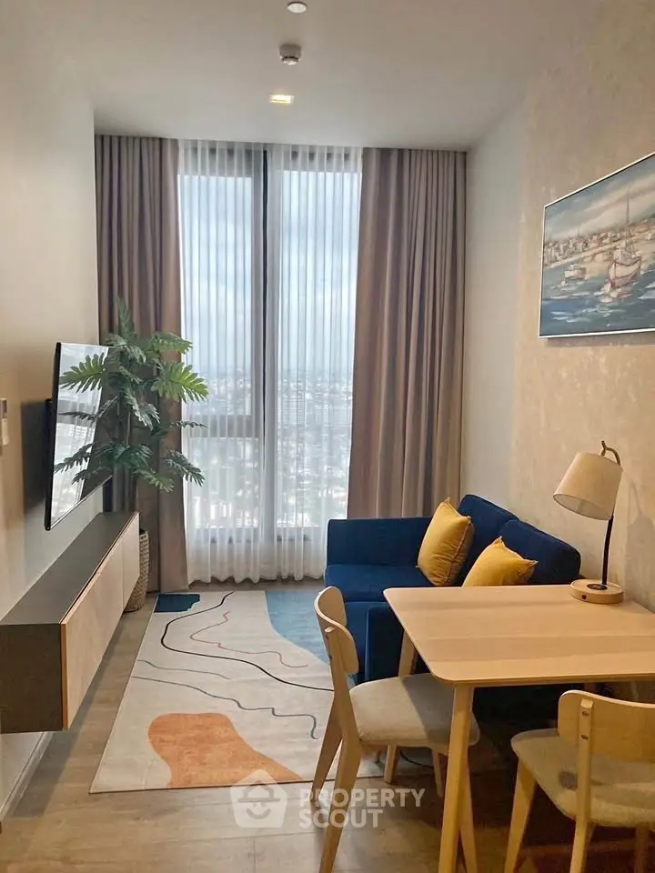 Modern living room with cozy seating and city view, perfect for urban living.