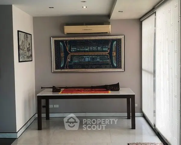 Elegant interior with modern art and air conditioning in a stylish living space.