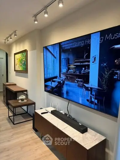 Modern living room with stylish decor and wall-mounted TV