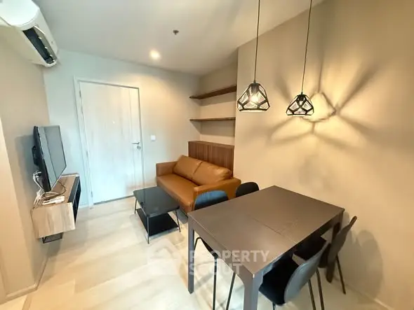 Modern living room with stylish furniture and elegant lighting in a cozy apartment.