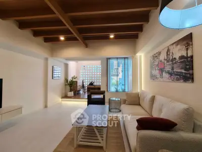 Spacious living room with modern decor and cozy seating area