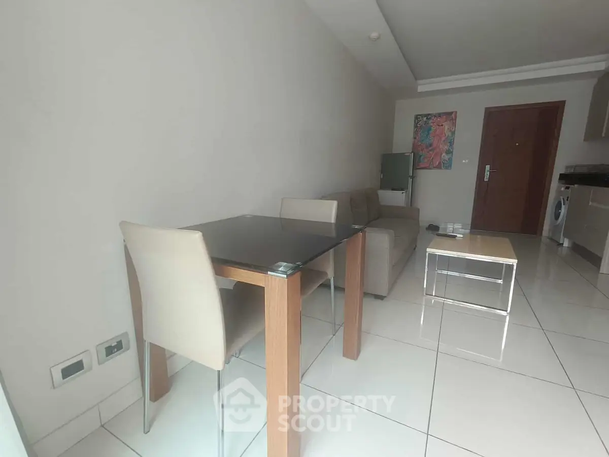 Modern living room with sleek furniture and open kitchen layout