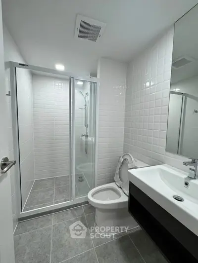 Modern bathroom with sleek shower and elegant fixtures