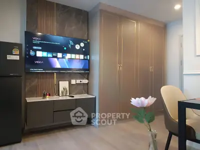 Modern living room with sleek TV setup and elegant cabinetry