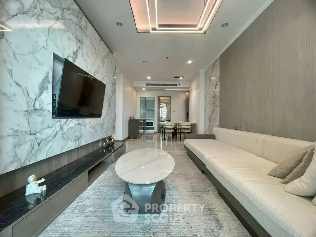 Luxurious modern living room with marble accents and sleek furniture design.