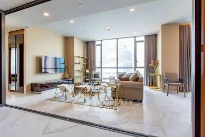 Luxurious modern living room with elegant decor and large windows in high-rise apartment.