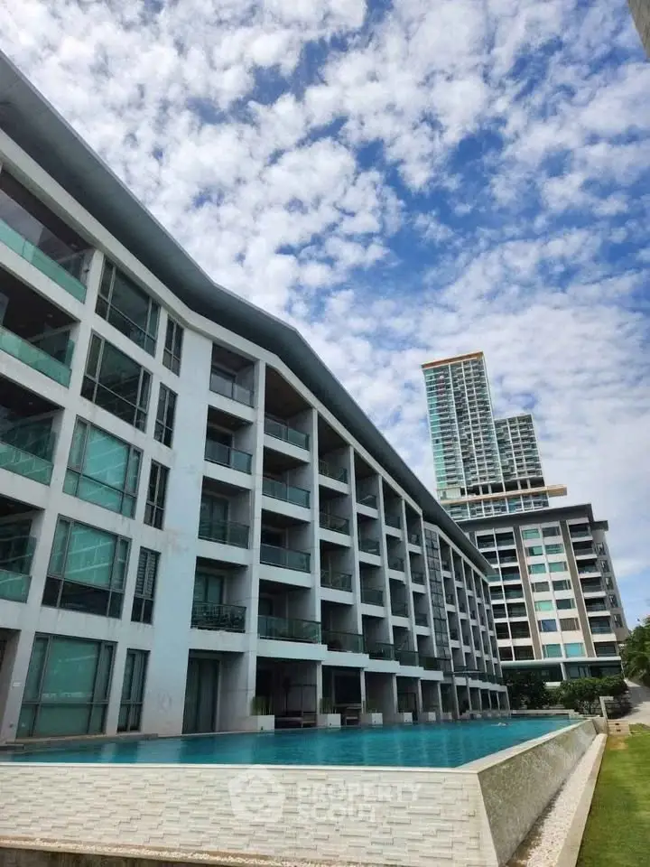 Modern apartment complex with pool and stunning sky view
